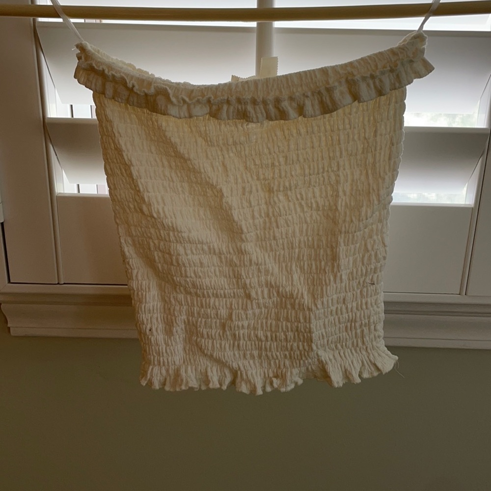 Elastic cream tube top